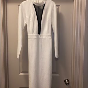 Cream colored long sleeve mini dress.